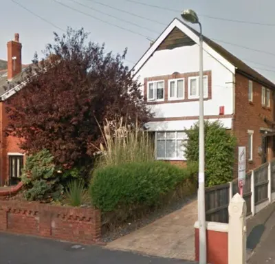 a house with a street light in front of it at Charles Alexander Short Stay - Derbe House in Lytham St Annes