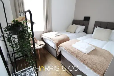 a small room with two beds and a couch at Phoenix Rise in Fleetwood