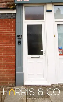 a white door on the side of a building at Phoenix Rise in Fleetwood