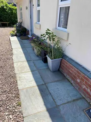 a house with plants on the side of it at Helens Haven First floor apartment via stairs in Preston