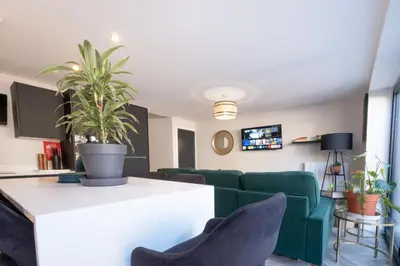 a living room with a green couch and chairs at Luxury 4BDR House By Torr Property Group Short Lets & Serviced Accommodation With Free Gated Secure Parking & Private Patio Garden Liverpool in Liverpool