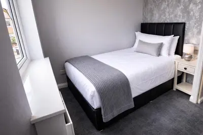 a small bedroom with a bed and a window at Liverpool House Near City Centre in Liverpool