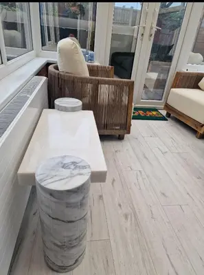 a room with a table and a bench and chairs at Liverpool House Near City Centre in Liverpool