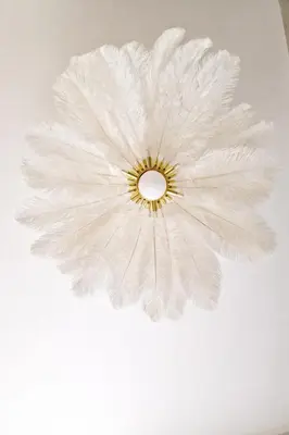 a chandelier with white feathers on a ceiling at Liverpool House Near City Centre in Liverpool