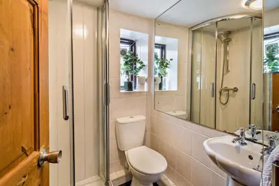 a bathroom with a toilet and a sink and a shower at 2 Bed in Ulverston oc-q29885 in Ulverston