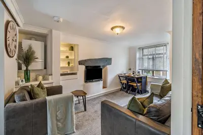 a living room with a couch and a table at 2 Bed in Ulverston oc-q29885 in Ulverston
