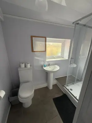 a white bathroom with a toilet and a sink at Suli House-Families and Couples only- 3 minutes' walk to the seafront in Blackpool