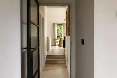 a hallway with a door leading into a room at The Lookout in Preston