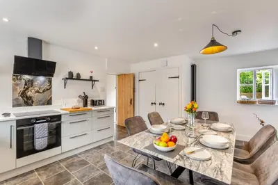 a kitchen and dining room with a table and chairs at 3 Bed in Newton In Cartmel oc-a29796 in High Newton