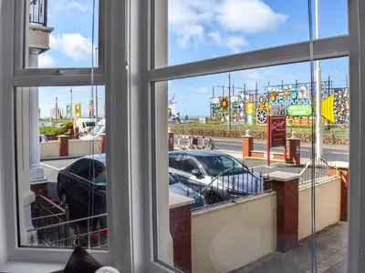 a window with a view of a parking lot at Drumford in Blackpool