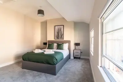 a bedroom with a bed and a window at Charming 1 Bedroom Apartment in Central Liverpool in Liverpool