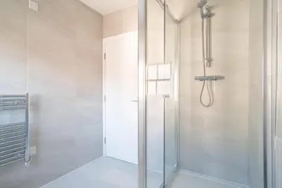 a shower with a glass door in a bathroom at Charming 1 Bedroom Apartment in Central Liverpool in Liverpool