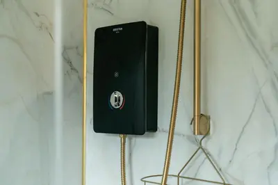 a black phone is hanging on a wall at Peacock Room at Field View Cottage in Eccleston