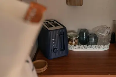 a toaster sitting on a counter in a kitchen at Peacock Room at Field View Cottage in Eccleston