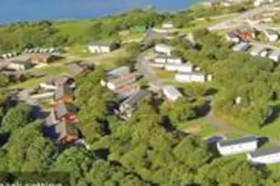 an overhead view of a village with houses and trees at Lagooncombe modern and cosy holiday home in Haverigg