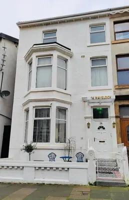 a white house with a white front door at Double Room with Private Bathroom Partial Tower view 16 Havelock Street - 5 in Blackpool