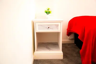 a white night stand with a sink in a room at Lucky Home 24 - Ideal for Trade & Family - 2 Bedrooms - 3 Beds - Max 4 Guests - Close to BAE, Docks, Lake District, Beaches in Barrow in Furness