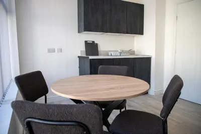a dining room with a wooden table and chairs at Ground Floor - Balmoral Stays - Free Wifi in Blackpool