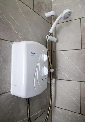 a shower in a bathroom with a shower head at Ground Floor - Balmoral Stays - Free Wifi in Blackpool