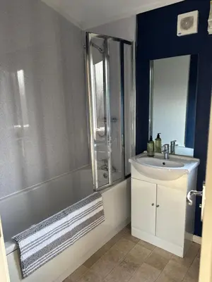 a bathroom with a tub and a sink and a shower at Gressingham 9 - South Lakes Leisure Village - lodge on the lake in Carnforth