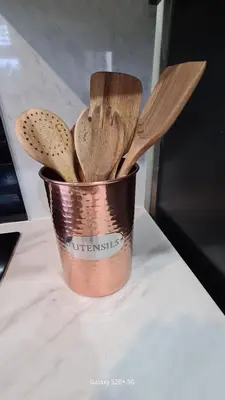 a metal bucket filled with wooden utensils on a counter at Quakers Field View in Pennington