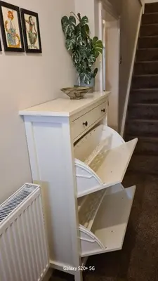 a white cabinet with a plant on top of it at Quakers Field View in Pennington