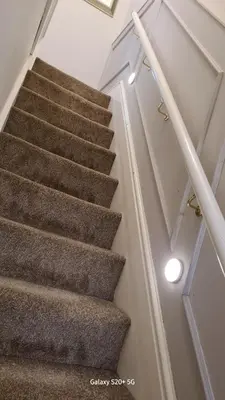 a staircase in a house with a stair case at Quakers Field View in Pennington