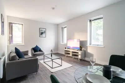 a living room with a couch and a tv at Modern 1 Bed Apartment in Waterloo Liverpool in Liverpool