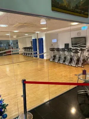 a gymnasium with a basketball court and a wooden floor at Inside No.2 Retreat in Carnforth
