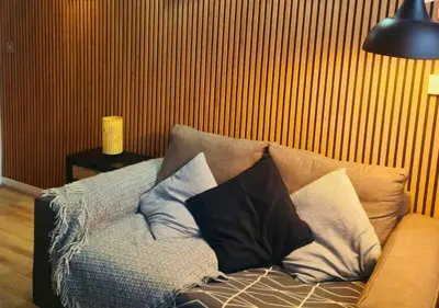 a couch with pillows on it in a living room at The Halifax Suites Near Albert Dock sleeps 3 in Liverpool