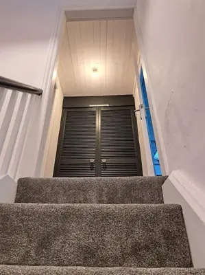 a set of stairs leading up to a building at Cosy 19th century town-house in Clitheroe