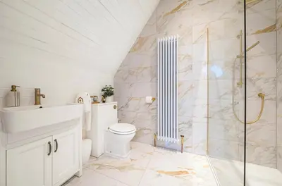 a bathroom with a toilet and a shower at Chapel Apartment in Liverpool