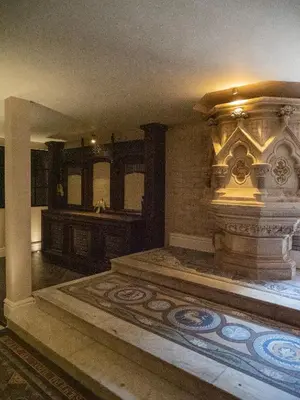 a large room with a fireplace and a tile floor at Chapel Apartment in Liverpool