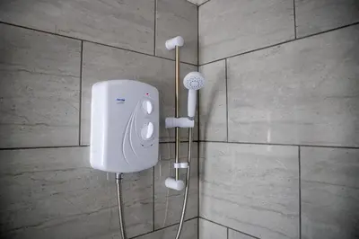 a soap dispenser on a wall in a bathroom at Balmoral Stays 3 - First Floor in Blackpool