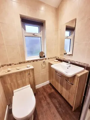 a bathroom with a toilet and a sink at Central Lancaster City Centre Terraced Gem in Lancaster