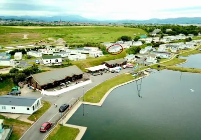 an aerial view of a small town next to a body of water at Sandpiper Port Haverigg Marina in Millom