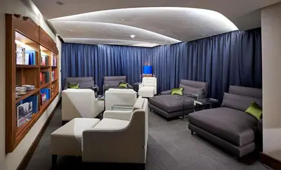 a waiting room with chairs and couches in a clinic at DoubleTree by Hilton Hotel & Spa Liverpool in Liverpool