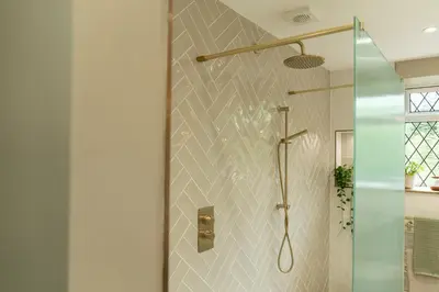 a bathroom with a shower with a glass door at Heather room at field view cottage in Eccleston