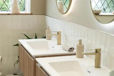 a bathroom with two sinks and a mirror at Heather room at field view cottage in Eccleston