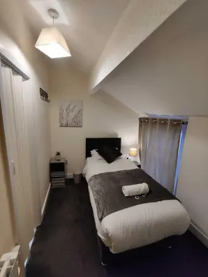 a bedroom with a large bed in a room at North Coast Hotel in Blackpool