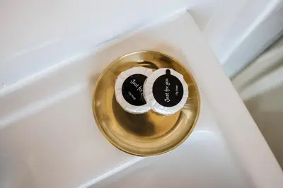 a gold door knob on a white door at Stylish Prime Location Apartment by VICHY in Liverpool