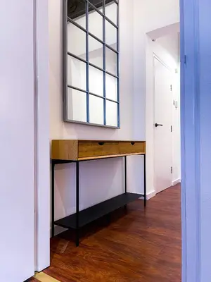 a dressing table with a mirror on a wall at Stylish Loft Apartament - City Center L1 in Liverpool