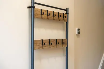 a shelving unit with wooden shelves in a room at Casa Arkles - next to stadium - free parking in Liverpool