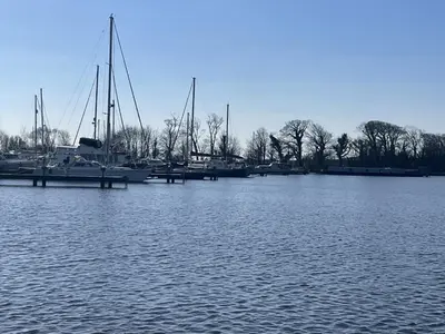 a group of boats are docked in a marina at The Thimble static Holiday Home in Lancaster