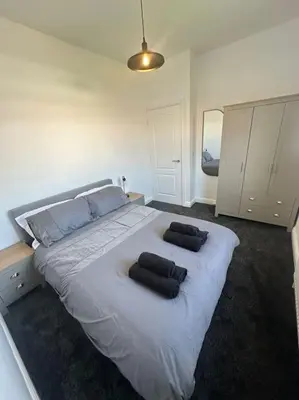 a bedroom with a large white bed with two pillows on it at New Luxury apartment, sea viewWith parking in Blackpool
