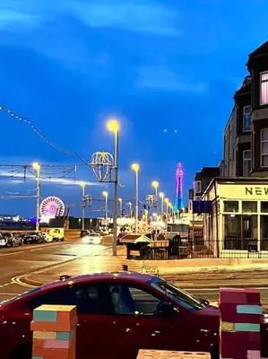 a car parked on a city street at night at New Luxury apartment, sea viewWith parking in Blackpool