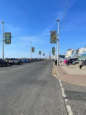 an empty street with cars parked on the side of the road at New Luxury apartment, sea viewWith parking in Blackpool