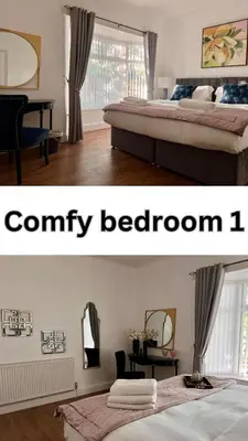 a room with two beds and a bedroom with a comfy bedroom at Spacious Home - Sleeps 5 persons - Minutes Walk from Anfield Stadium in Liverpool