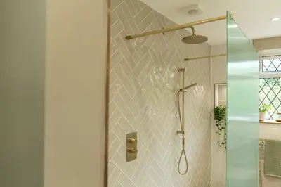a bathroom with a shower with a glass door at Fern room at field view cottage in Eccleston