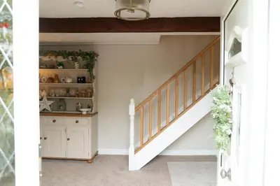 a staircase in a home with a white stair case at Fern room at field view cottage in Eccleston